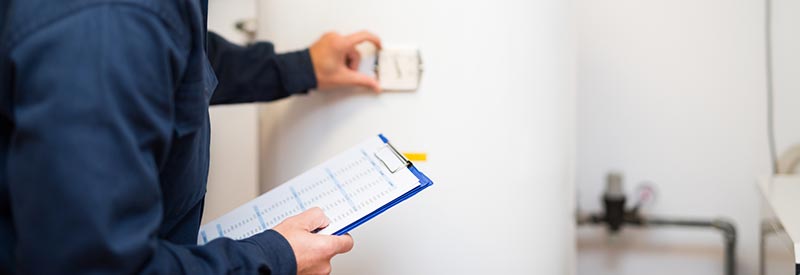 home inspector checking water heater